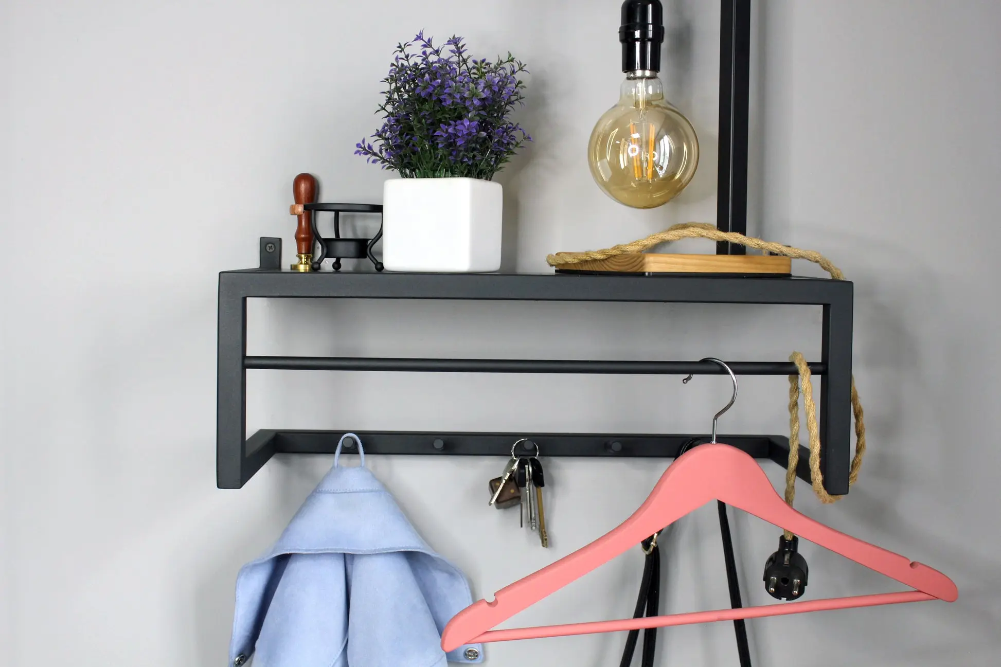 Modern wall-mounted hanger system by IronEdge Designs